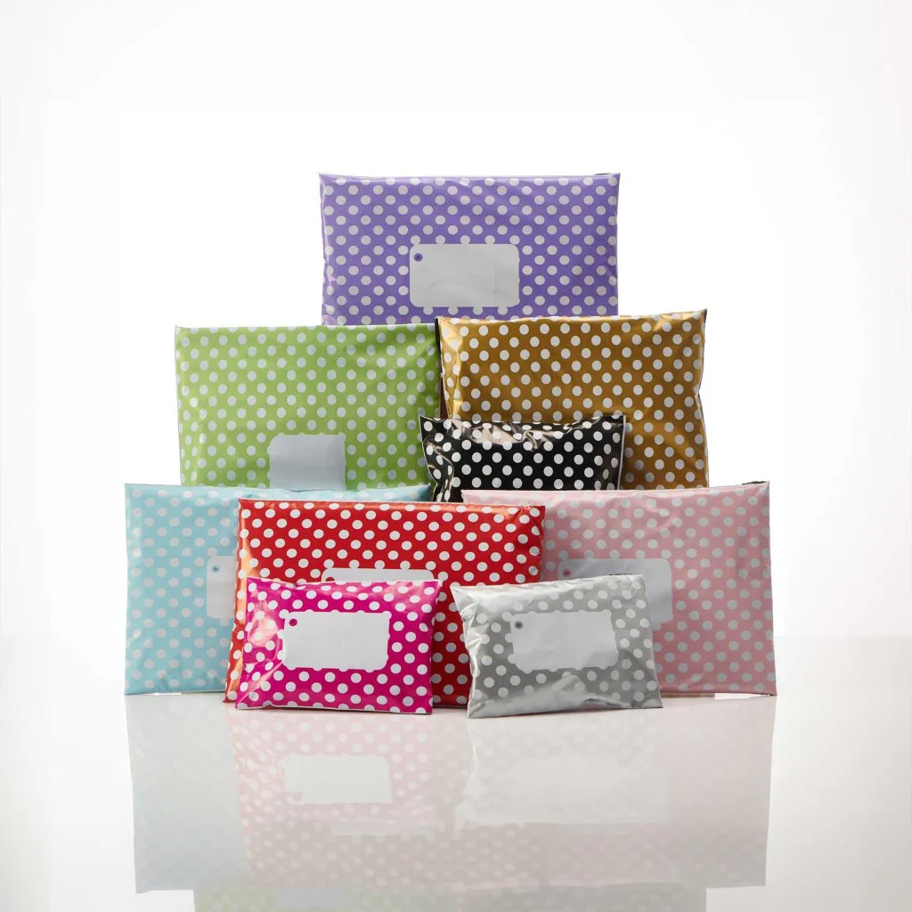 a selection of envelopes and packages in different colours with polka dot pattern